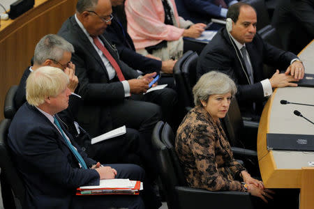 British Prime Minister Theresa May sits in front of British Foreign Secretary Boris Johnson during a meeting to discuss the current situation in Libya during the 72nd United Nations General Assembly at U.N. headquarters in New York, U.S., September 20, 2017. REUTERS/Lucas Jackson