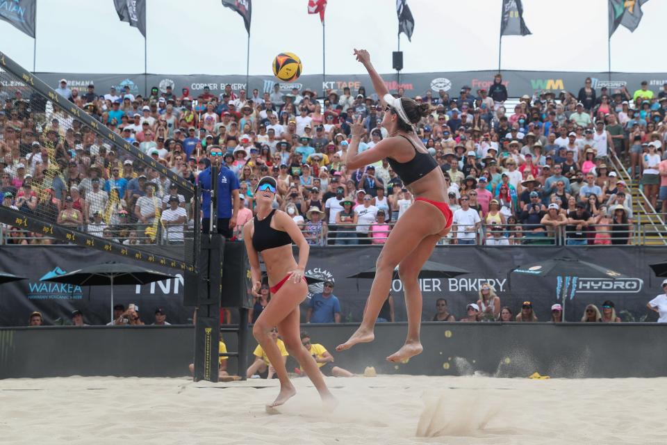 Sarah Sponcil attacks for a kill during a match in the AVP Hermosa Beach Open in July 2022.