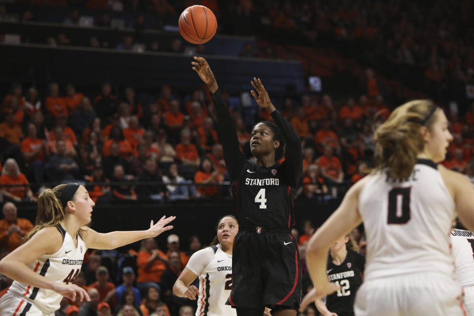 Stanford's Nadia Fingall (4) shoots despite defense from Oregon State's Taylor Jones (44), Destiny Slocum (24) and Mikayla Pivec (0) during the second half of an NCAA college basketball game in Corvallis, Ore., Sunday, Jan. 19, 2020. (AP Photo/Amanda Loman)