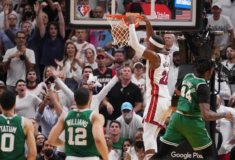 East finals: Heat forward  Jimmy Butler (22) throws down a two-handed slam against the Celtics during the second half of Game 1.