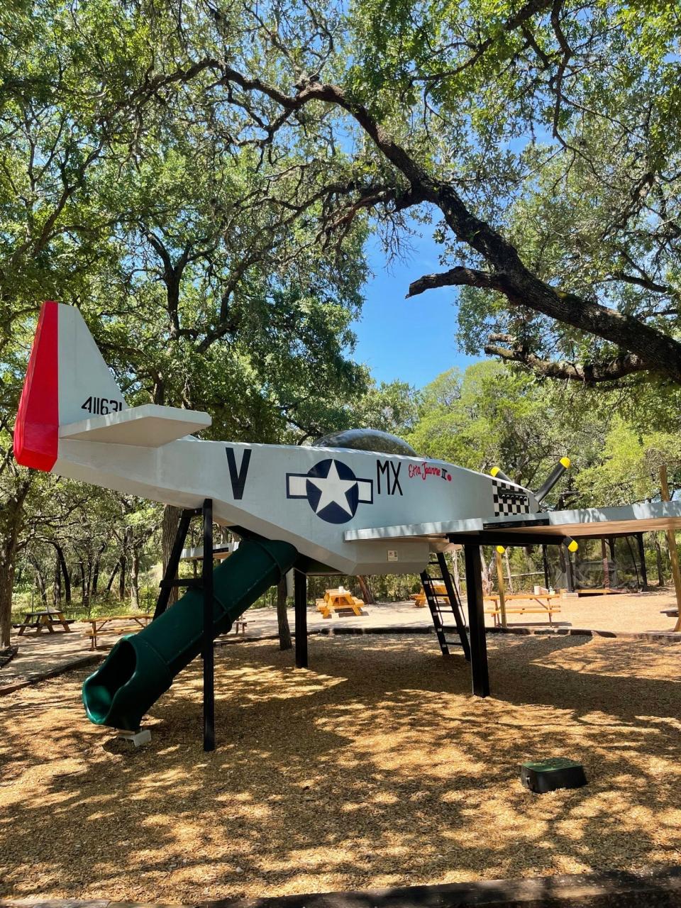 A slide spills out of a replica P-51 Mustang fighter-bomber at the Memorial Miniature Golf and Museum, where the Valentina's Tex Mex BBQ owners operate Cash Cow Burger Co.