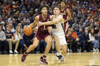 Florida State's Jalen Warley (1) drives with the ball against Virginia during the first half of an NCAA college basketball game in Charlottesville, Va., Saturday, Dec. 3, 2022. (AP Photo/Mike Kropf)
