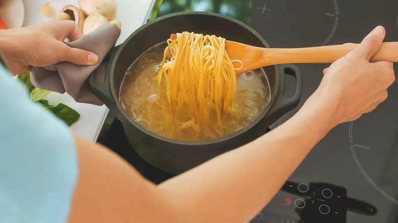 woman cooking pasta