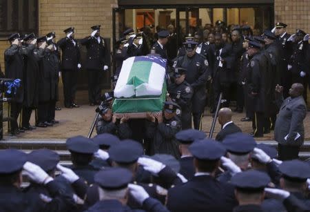 The casket of slain New York City Police (NYPD) officer Randolph Holder is carried from the Greater Allen A.M.E. Cathedral of New York following his funeral service in the Queens borough of New York City, October 28, 2015. REUTERS/Shannon Stapleton