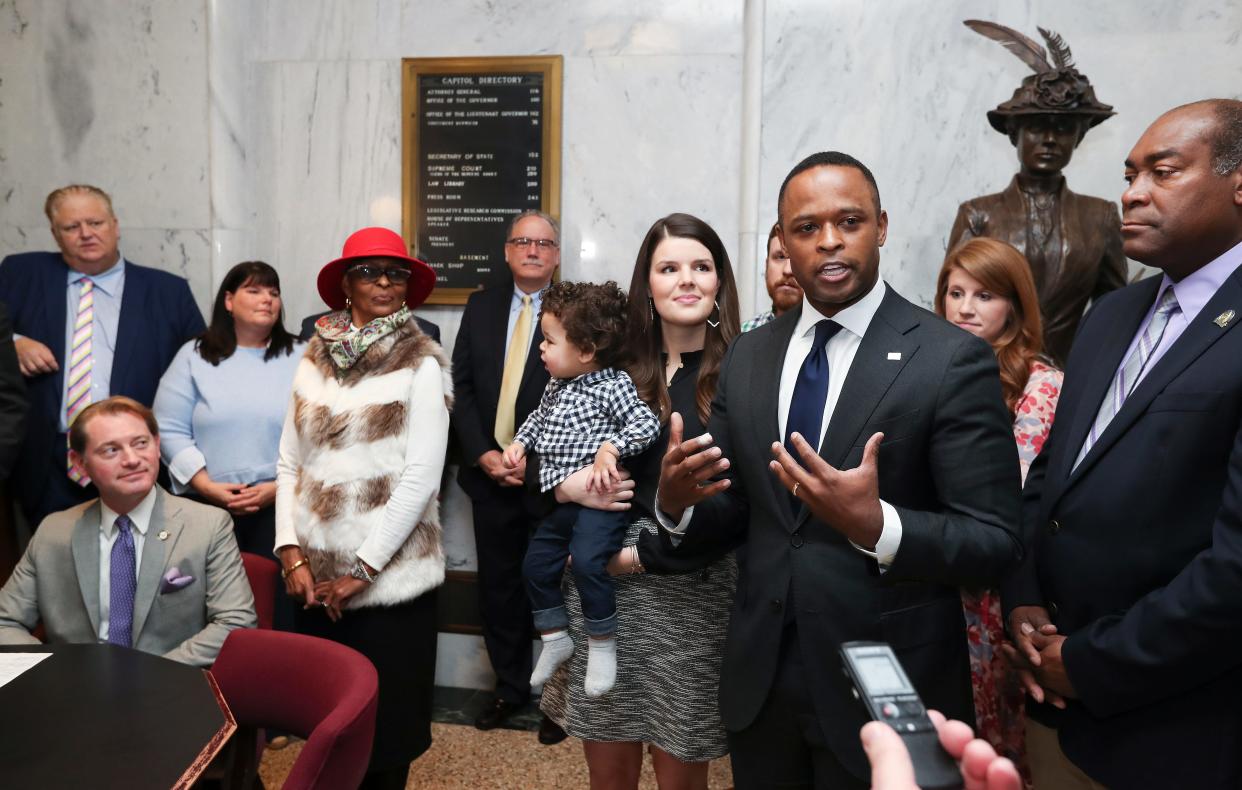 Kentucky Attorney General Daniel Cameron, third from right, was joined by supporters, including his wife Makenze Cameron and their son Theodore (1) next to him, after he signed papers to officially enter the race for governor at the State Capitol Building in Frankfort, Ky. on Jan. 3, 2023.  