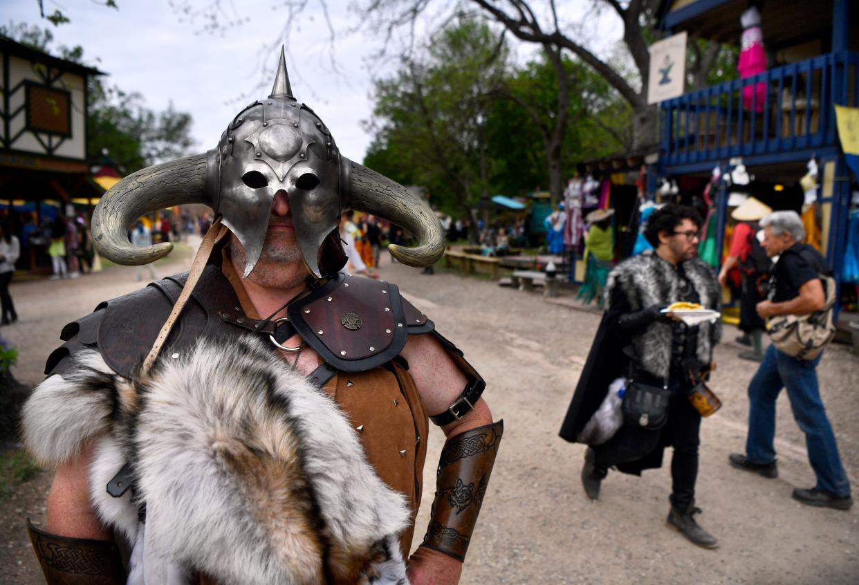 Eric Smelley of Dallas wears a helmet modeled after fantasy artist Frank Frazetta’s painting “Death Dealer” at the Scarborough Renaissance Festival in Waxahachie on April 9. While he purchased the helmet online, the rest of his costume he pieced together from purchases at other Renaissance festivals in the the region.
