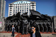 <p>A Chinese man poses in front of a monument commemorating the Korean War on the Yalu river in the border city of Dandong, Liaoning province, northern China across from the city of Sinuiju, North Korea on May 24, 2017 in Dandong, China. (Photo: Kevin Frayer/Getty Images) </p>