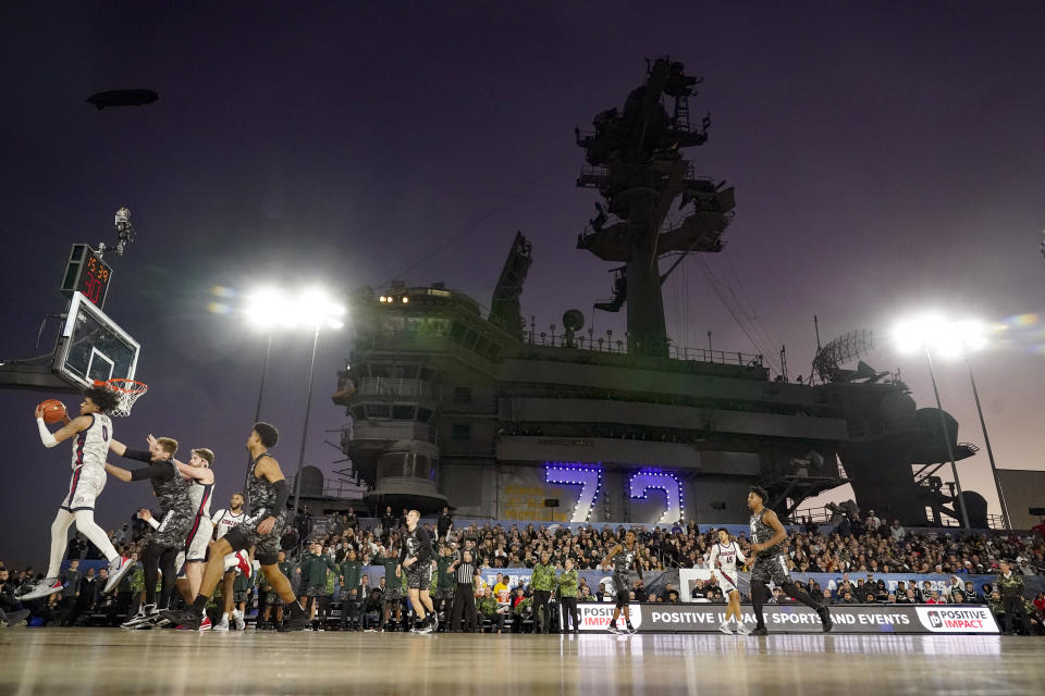 Gonzaga guard Julian Strawther (0) grabs a rebound during the second half of the Carrier Classic NCAA college basketball game against Michigan State aboard the USS Abraham Lincoln, Friday, Nov. 11, 2022, in Coronado, Calif. (AP Photo/Gregory Bull)