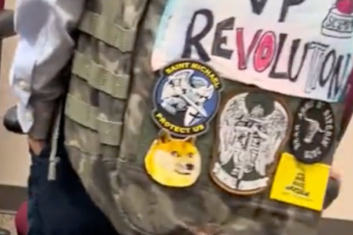 A video screenshot shows the Gadsden flag on the bottom right of the boy’s backpack (Screenshot / X/Twitter / Connor Boyack)