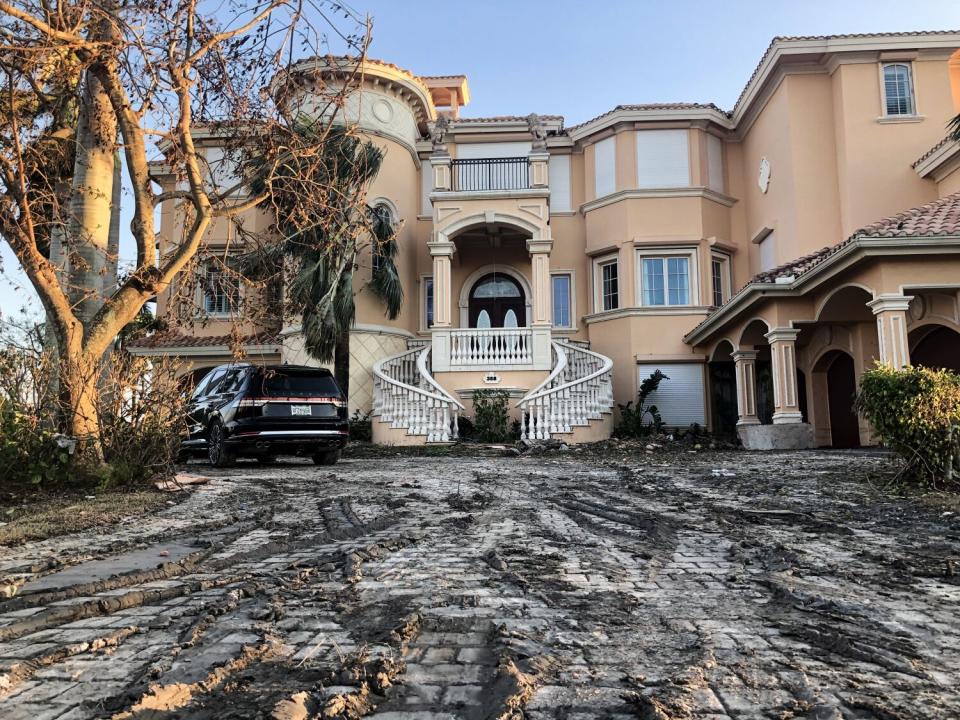 A house sits damaged