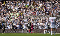 West Bromwich Albion's fans reacts after Southampton goalkeeper Alex McCarthy made a save, during the English Football League Championship play-off, semi-final, first leg soccer match between West Bromwich Albion and Southampton, at The Hawthorns, in West Bromwich, England, Sunday May 12, 2024. (Jacob King/PA via AP)
