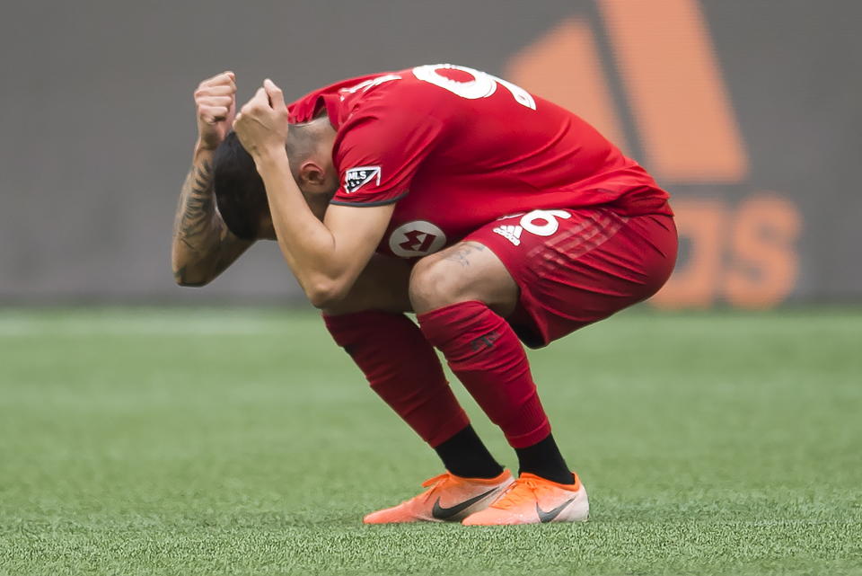 Toronto FC defender Auro (96) reacts to the team's loss to the Seattle Sounders in the MLS Cup soccer match in Seattle on Sunday, Nov. 10, 2019. (Jonathan Hayward/The Canadian Press via AP)