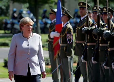 German Chancellor Angela Merkel reviews the guard of honour during the welcoming ceremony at the Czech government headquarters in Prague, Czech Republic August 25, 2016. REUTERS/David W Cerny