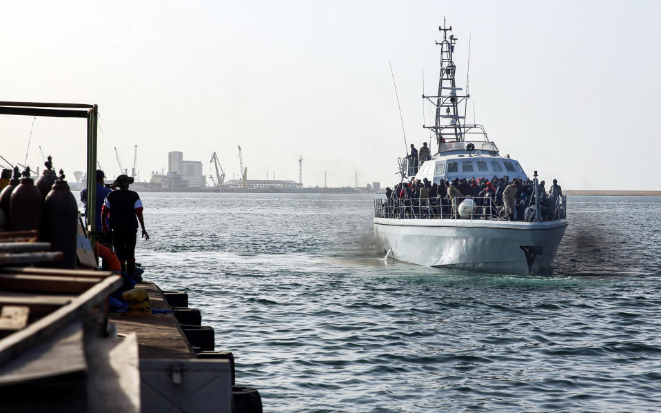 A Libyan coastguard vessel carries migrants recovered off the coast of al-Khums, about 120 kilometres east of the capital, as it approaches the pier in Tripoli's naval base on Feb. 10, 2021. (AFP via Getty Images)