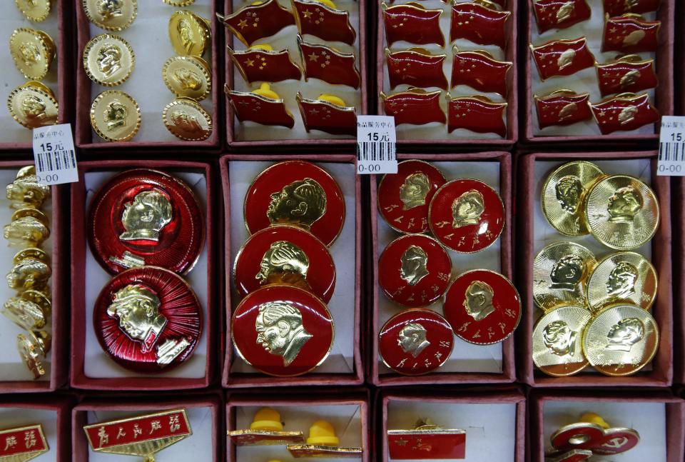 Pins bearing images of China's late Chairman Mao Zedong are displayed at a souvenir shop in Beijing