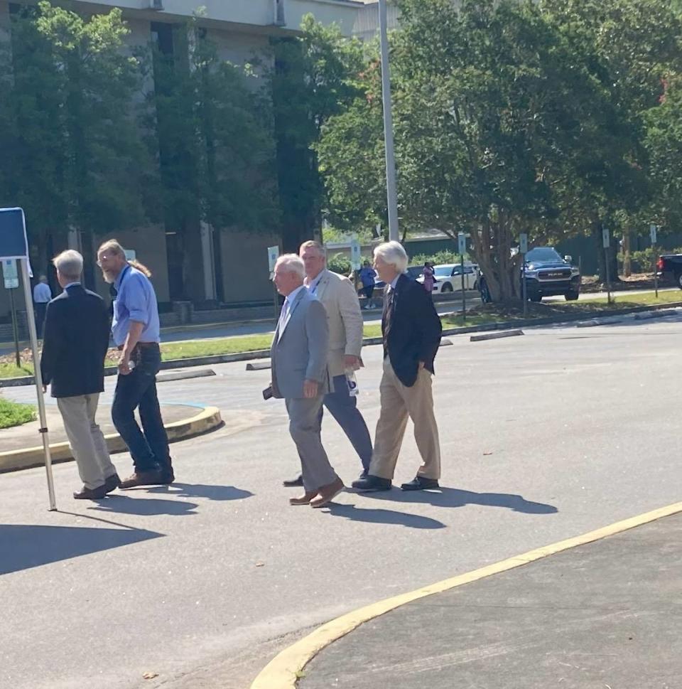 Former DHEC director Doug Bryant, far right, and former director Earl Hunter, third from right, attended a news event to launch the new Department of Environmental Services. The DES replaces DHEC, which was dissolved as a result of a government restructuring law. DHEC stood for the Department of Health and Environmental Control.