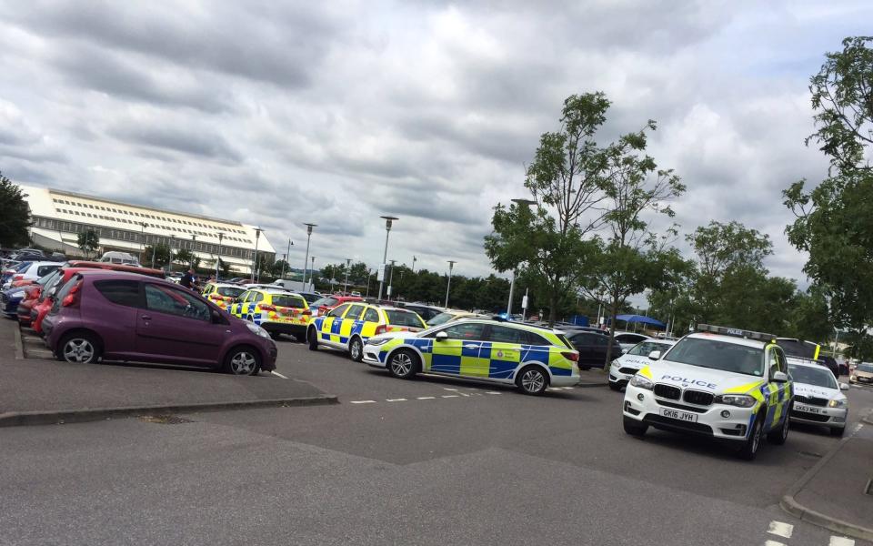 A large police presence in the Kent shopping centre car park - Credit: Michelle Hextall