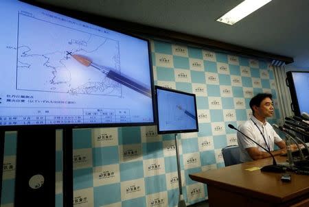 Japan Meteorological Agency's earthquake and tsunami observations division director Gen Aoki speaks next to screens showing the seismic event was indicated on North Korea and observed in Japan during a news conference at the Japan Meteorological Agency in Tokyo, Japan, September 9, 2016. REUTERS/Kim Kyung-Hoon
