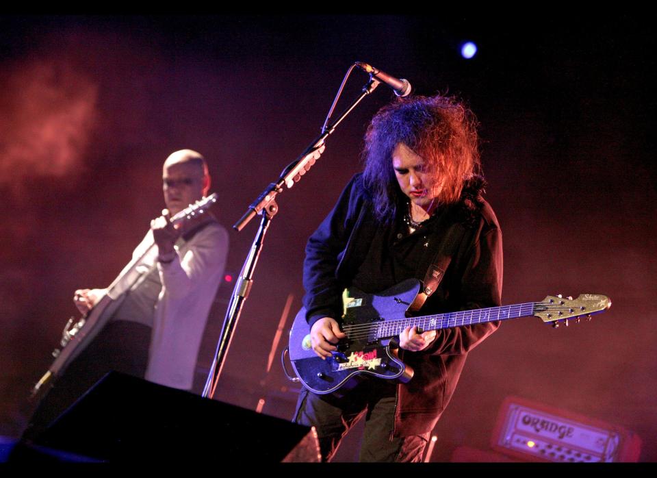 INDIO, CA - APRIL 19:  Musicians Porl Thompson (L) and Robert Smith of the band The Cure perform during day three of the Coachella Valley Music & Arts Festival 2009 held at the Empire Polo Club on April 19, 2009 in Indio, California.  (Photo by Trixie Textor/Getty Images)