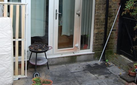 The patio where the body was found - Credit: Metropolitan Police