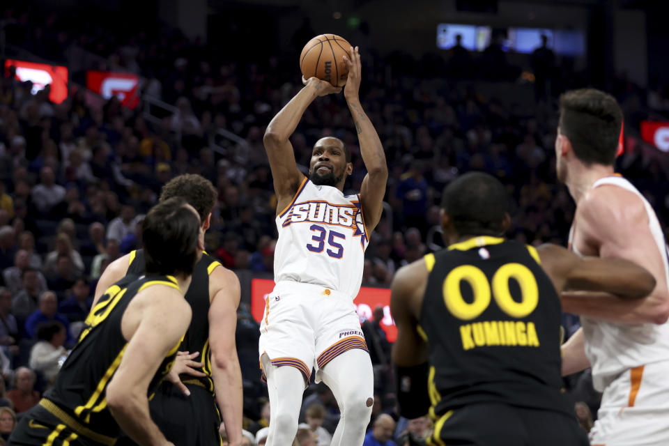 Phoenix Suns forward Kevin Durant (35) shoots during the first half of an NBA basketball game against the Golden State Warriors in San Francisco, Saturday, Feb. 10, 2024. (AP Photo/Jed Jacobsohn)