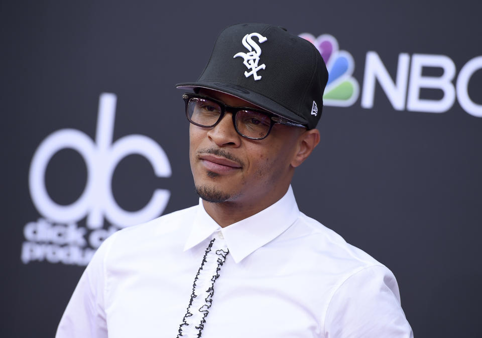 T.I. is facing backlash for comments about how he monitors his daughter's sex life. Here he is at the Billboard Music Awards last year. (Photo by Jordan Strauss/Invision/AP)