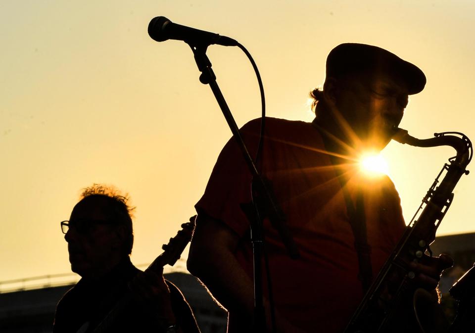 In this 2018 file photo, the suns sets as the Chicago R&B Kings perform on the stage at the River City Soul Fest on the Peoria riverfront.