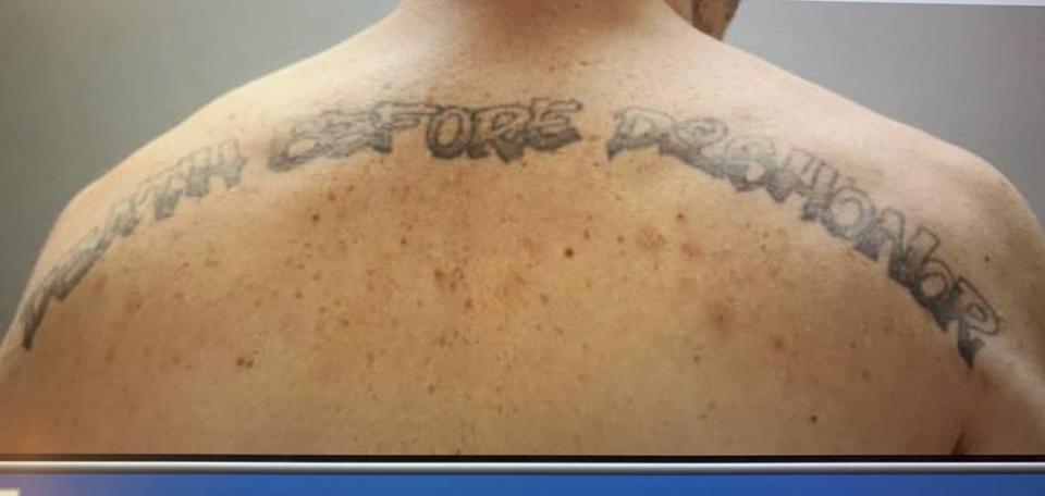 McDowell’s “Death Before Dishonor” tattoo across his shoulders