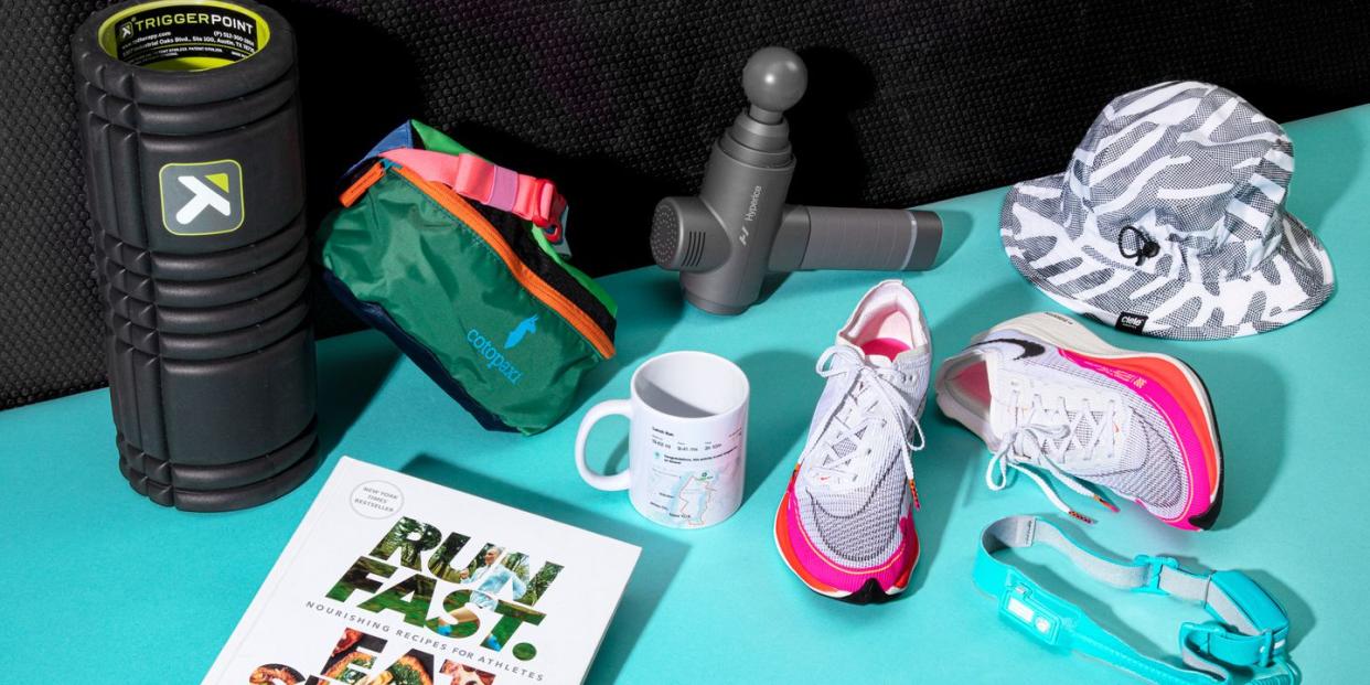 foam roller, fanny pack, bucket hat, running shoes, head lamp, strava mug, run fast eat slow book