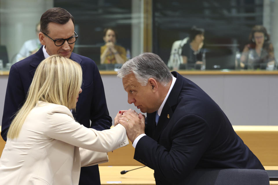 Hungary's Prime Minister Viktor Orban, right, speaks with Italy's Prime Minister Giorgia Meloni, center, and Poland's Prime Minister Mateusz Morawiecki, left, during a round table meeting at an EU summit in Brussels, Thursday, June 29, 2023. European leaders meet for a two-day summit to discuss Ukraine, migration and the economy. (AP Photo/Geert Vanden Wijngaert)