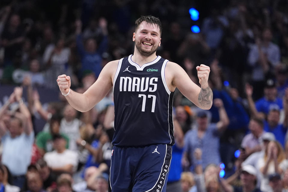 Dallas Mavericks guard Luka Doncic (77) reacts after a play during the first half in Game 4 of the NBA basketball finals against the Boston Celtics, Friday, June 14, 2024, in Dallas. (AP Photo/Julio Cortez)