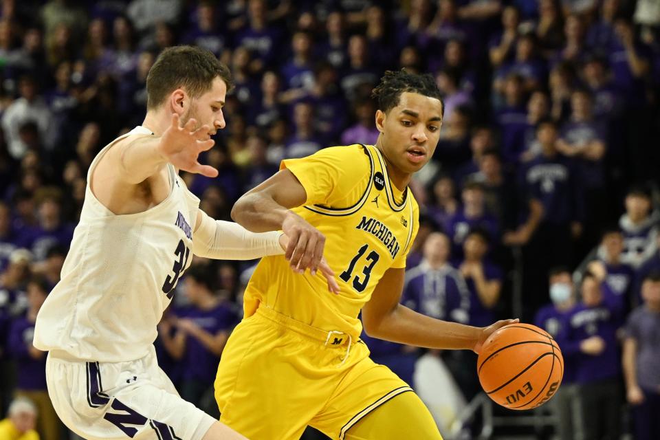 Michigan guard Jett Howard drives with the basketball during the first half on Thursday, Feb. 2, 2023, in Evanston, Illinois.