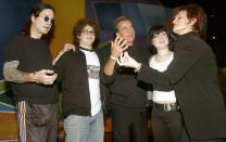 Sharon Osbournes jokes around with Dick Clark as (L to R) husband Ozzy Osbourne, son Jack and daughter Kelly look on before rehearsing on January 11, 2003 for the upcoming American Music Awards in Los Angeles. The family, who stars in the reality based show "The Osbournes," will host this years American Music Awards on January 13. REUTERS/Adrees Latif AL