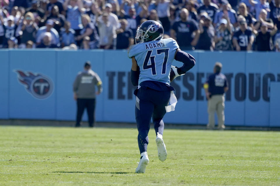 Tennessee Titans safety Andrew Adams runs an interception back 76-yards for a touchdown during the first half of an NFL football game against the Indianapolis Colts Sunday, Oct. 23, 2022, in Nashville, Tenn. (AP Photo/Mark Humphrey)