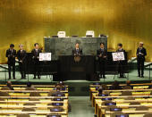 ADDS IDS- Members of South Korean K-pop band BTS, from left, V, Suga, Jin, RM, Jung Kook, Jimin and J-Hope appear at the Sustainable Development Goals meeting during the 76th session of the United Nations General Assembly, at the United Nations Headquarters on Monday, Sept. 20, 2021. In his General Assembly opening address on Tuesday, U.N. Secretary-General Antonio Guterres practically scolded world leaders for disappointing young people with a perceived inaction on climate change, inequalities and the lack of educational opportunities, among other issues important to young people. (John Angelillo/Pool via AP)