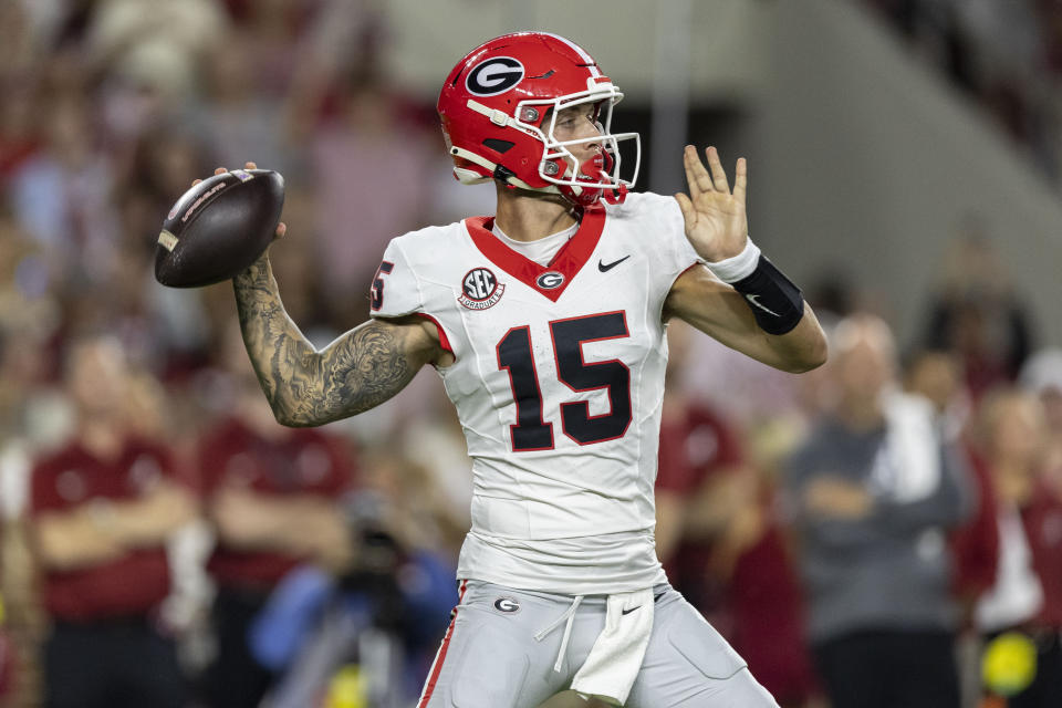 Georgia quarterback Carson Beck (15) throws the ball against Alabama during the first half of an NCAA college football game, Saturday, Sept. 28, 2024, in Tuscaloosa, Ala. (AP Photo/Vasha Hunt)