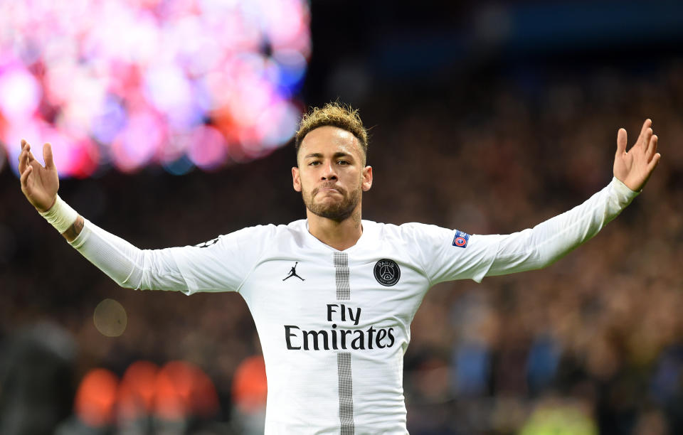 Neymar celebrates his first half goal in Paris Saint-Germain’s 2-1 victory over Liverpool. (Harriet Lander/Getty)