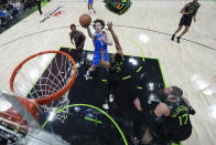 Oklahoma City Thunder guard Josh Giddey (3) goes to the basket against New Orleans Pelicans guard CJ McCollum (3) in the first half of Game 4 of an NBA basketball first-round playoff series in New Orleans, Monday, April 29, 2024. (AP Photo/Gerald Herbert)