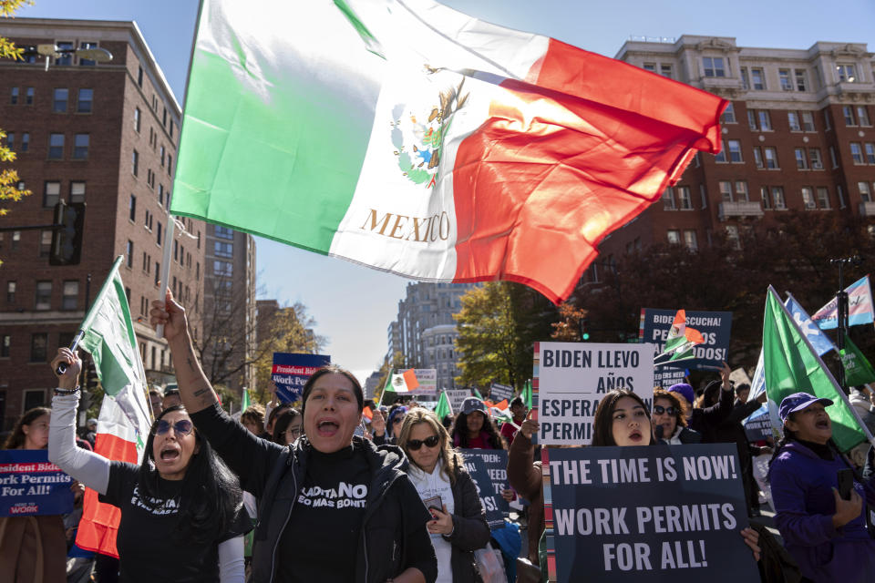 Immigrants who have been in U.S. for years, march to The White House asking for work permits for Deferred Action for Childhood Arrivals (DACA), and Temporary Protected Status (TPS), programs in Washington, Tuesday, Nov. 14, 2023. (AP Photo/Jose Luis Magana)