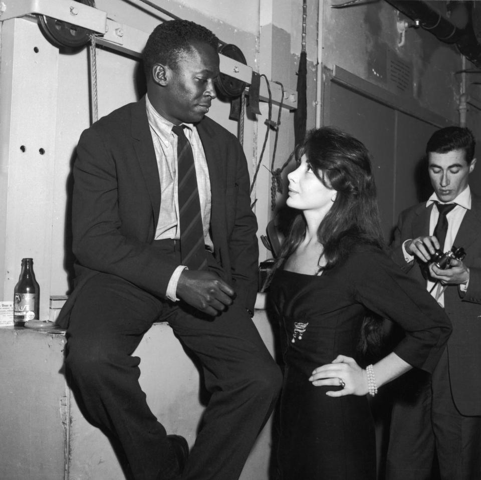 <em>The Man with the Horn</em>. Miles Davis and Juliette Gréco at the club Saint Germain in Paris, France, in 1958. (Credit: Andre SAS/Gamma-Rapho via Getty Images)