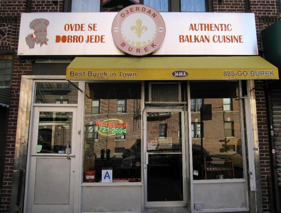 This March 9, 2013 photo shows one of many ethnic restaurants in Astoria, in the New York City borough of Queens. "Best Burek in Town" reads the canopy of the Djerdan Burek restaurant and bakery, which serves food from the Balkan region, including bureks, which are coils of yeasty, flaky dough filled with ground beef, spinach or cheese. Astoria and the adjacent neighborhood of Long Island City have much to offer tourists, from moderately priced hotels to museums, waterfront parksand lots of ethnic food. (AP Photo/Beth J. Harpaz)