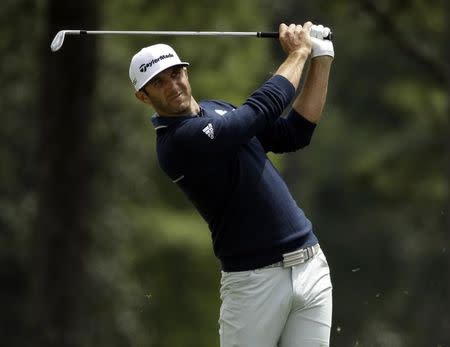 Apr 10, 2016; Augusta, GA, USA; Dustin Johnson hits his second shot on the 1st hole during the final round of the 2016 The Masters golf tournament at Augusta National Golf Club. Mandatory Credit: Rob Schumacher-USA TODAY Sports