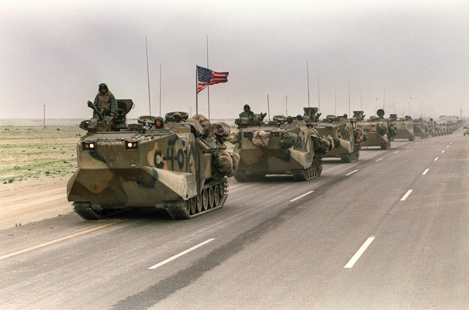 A convoy of U.S. Army tanks driving down the road from Kuwait towards Dhahran in the Saudi desert as U.S. troops begin their withdrawal from Kuwait on March 5, 1991. (Mike Nelson / AFP via Getty Images file)