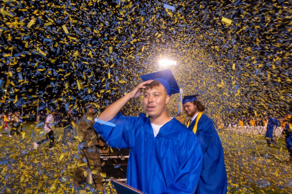 Serrano Graduates walk through confetti from confetti cannons concluding Serrano High School's Graduation Ceremony in Phelan CA on Thursday June 8, 2023. (James Quigg, for the Daily Press)