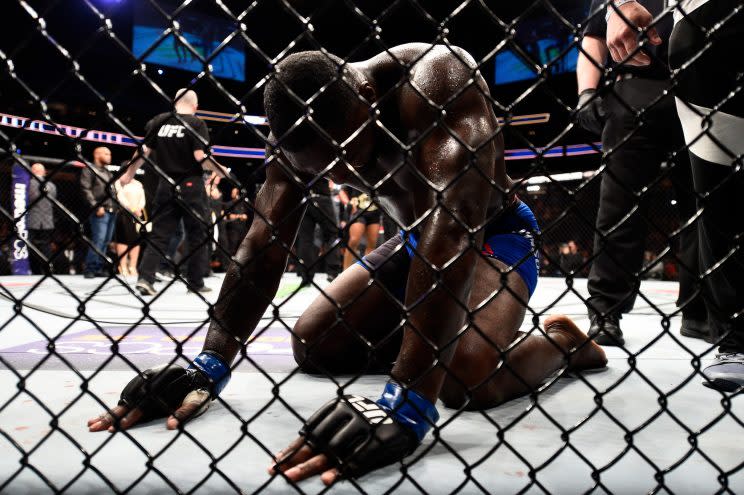 Anthony Johnson takes a moment to compose himself before getting off the canvas after his loss Saturday to Daniel Cormier at UFC 210 in Buffalo, N.Y. (Getty Images)