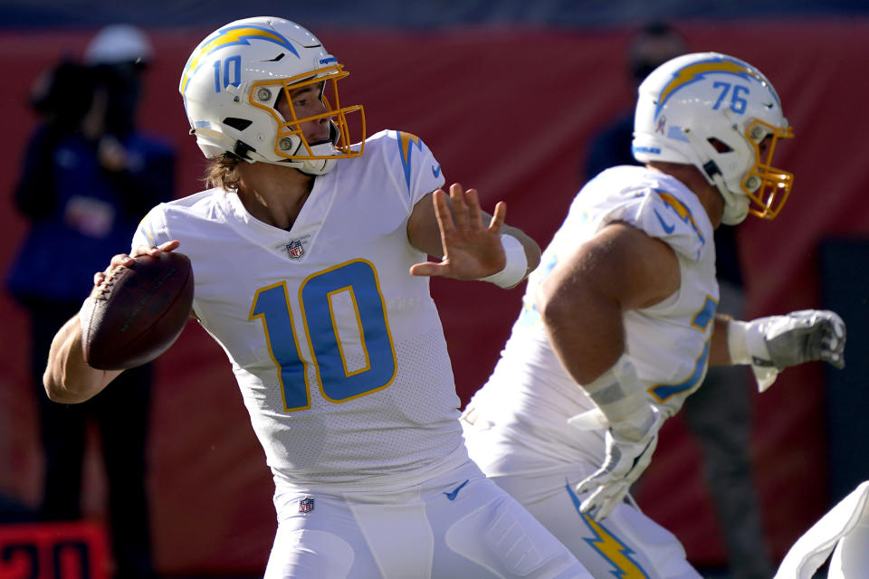 Los Angeles Chargers quarterback Justin Herbert (10) looks to pass during the first half of an NFL football game against the Denver Broncos, Sunday, Nov. 1, 2020, in Denver. (AP Photo/David Zalubowski)