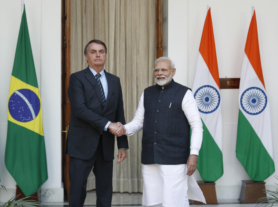 Indian Prime Minister Narendra Modi, right, shakes hand with Brazil's President Jair Bolsonaro before their delegation level meeting in New Delhi, India, Saturday, Jan. 25, 2020. Bolsonaro is this year's chief guest for India's Republic day parade. (AP Photo/Manish Swarup)