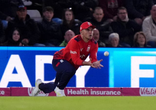 England's Sam Curran dives to take a boundary catch in a T20I against Australia.