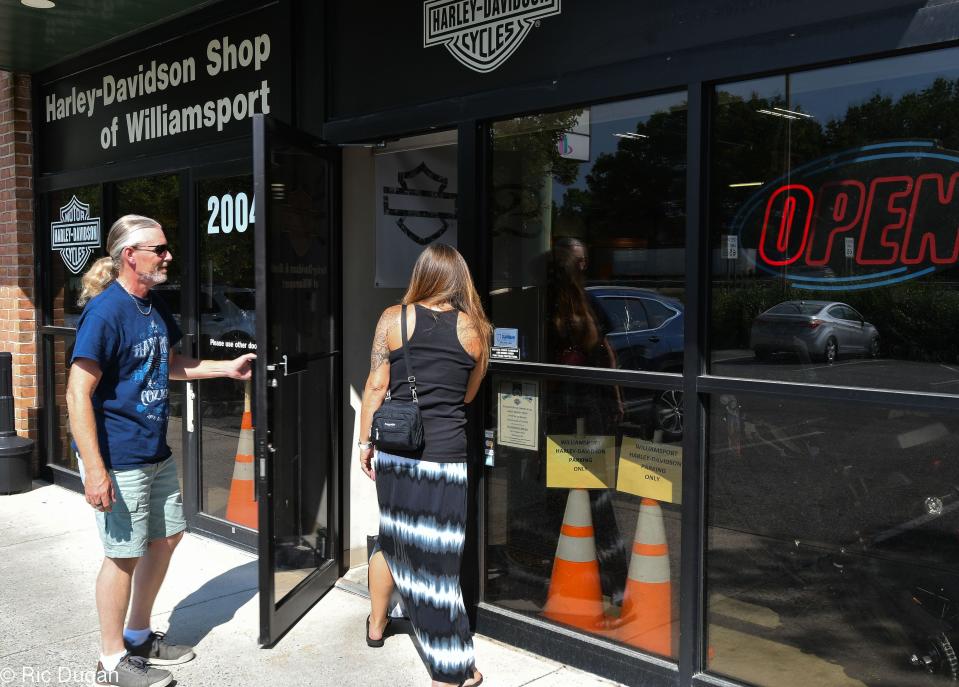 Customers enter the Harley-Davidson of Williamsport on Friday. The dealership will be closing it's doors on August 31.