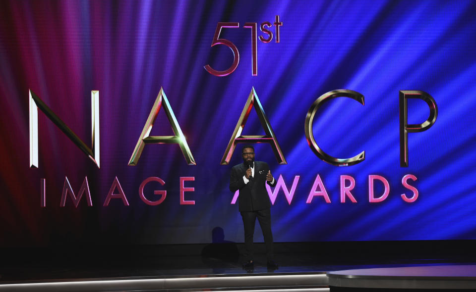 Host Anthony Anderson speaks onstage at the 51st NAACP Image Awards at the Pasadena Civic Auditorium on Saturday, Feb. 22, 2020, in Pasadena, Calif. (AP Photo/Chris Pizzello)